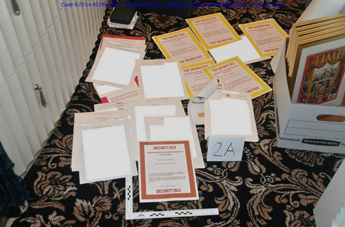 An undated photo released by the US Department of Justice on August 31, 2022 shows  documents allegedly seized at Mar-a-Lago spread over a carpet