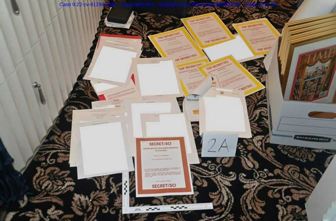 An undated photo released by the US Department of Justice on August 31, 2022 shows  documents allegedly seized at Mar-a-Lago spread over a carpet An undated photo released by the US Department of Justice on August 31, 2022 shows  documents allegedly seized at Mar-a-Lago spread over a carpet