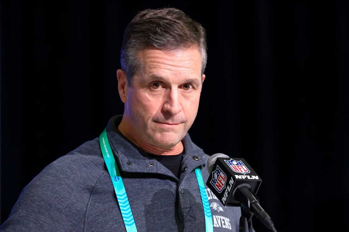 John Harbaugh of the Baltimore Ravens speaks to the media during the NFL Combine John Harbaugh of the Baltimore Ravens speaks to the media during the NFL Combine