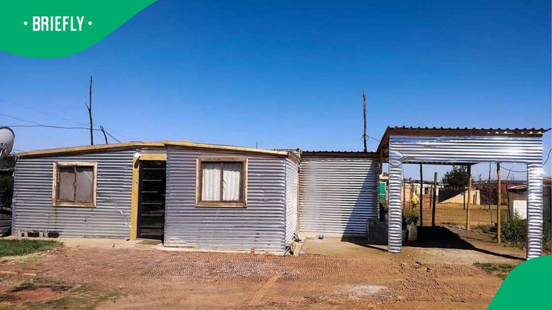 A woman showed the exterior of her shack.