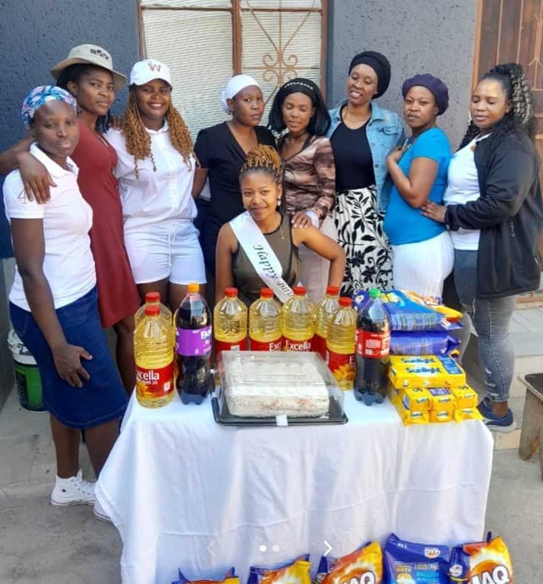 A woman received groceries as a birthday gift from her friends.