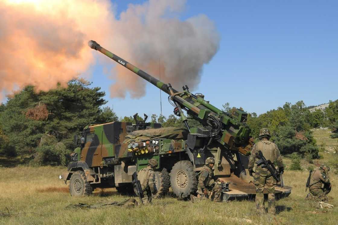 Members of the French army fire a Howitzer artillery system during a high intensity shooting exercice in Canjuers, southeastern France, on October 11, 2021 Members of the French army fire a Howitzer artillery system during a high intensity shooting exercice in Canjuers, southeastern France, on October 11, 2021