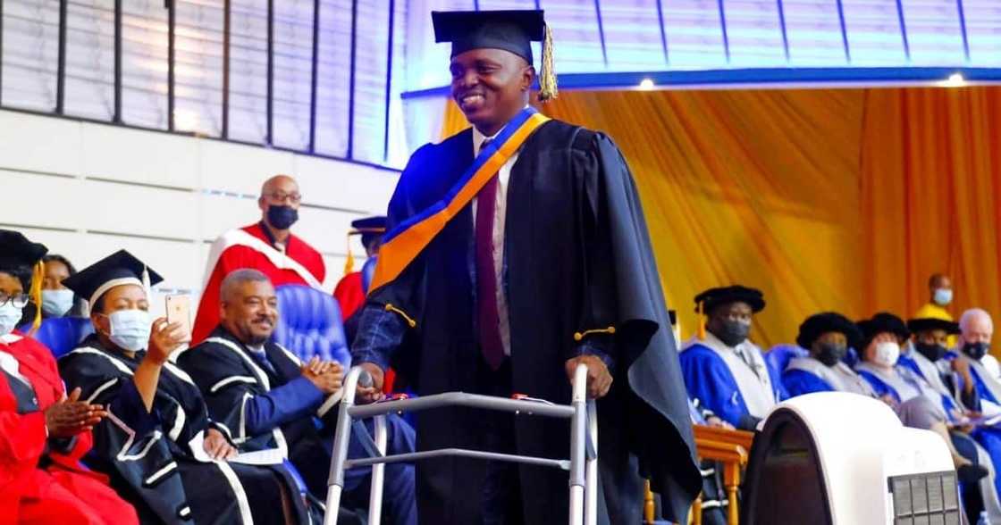 Robbery Shooting, Survivor Graduates, Degree 14 Years After, Partially Paralysed