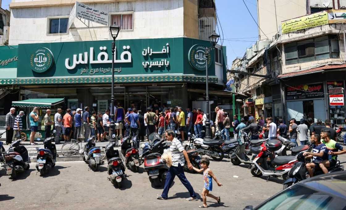 A long queue stretches down the street from a Beirut bakery. In some parts of Lebanon, there have been reports of fights or even gunfire outside bakeries as anger boils over A long queue stretches down the street from a Beirut bakery. In some parts of Lebanon, there have been reports of fights or even gunfire outside bakeries as anger boils over