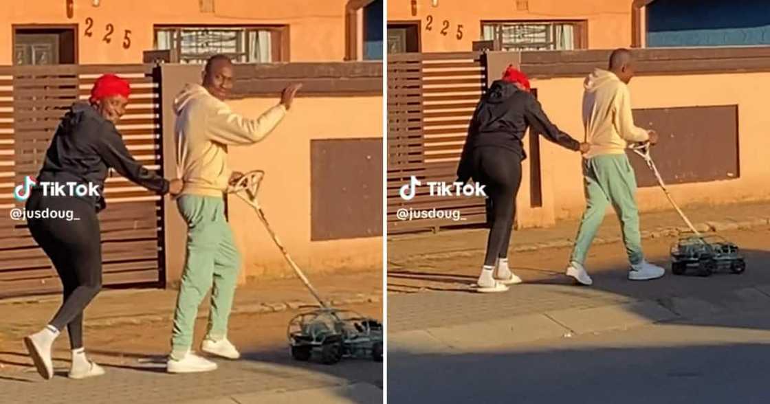 Video of kasi couple pushing a wire car in the street Video of kasi couple pushing a wire car in the street
