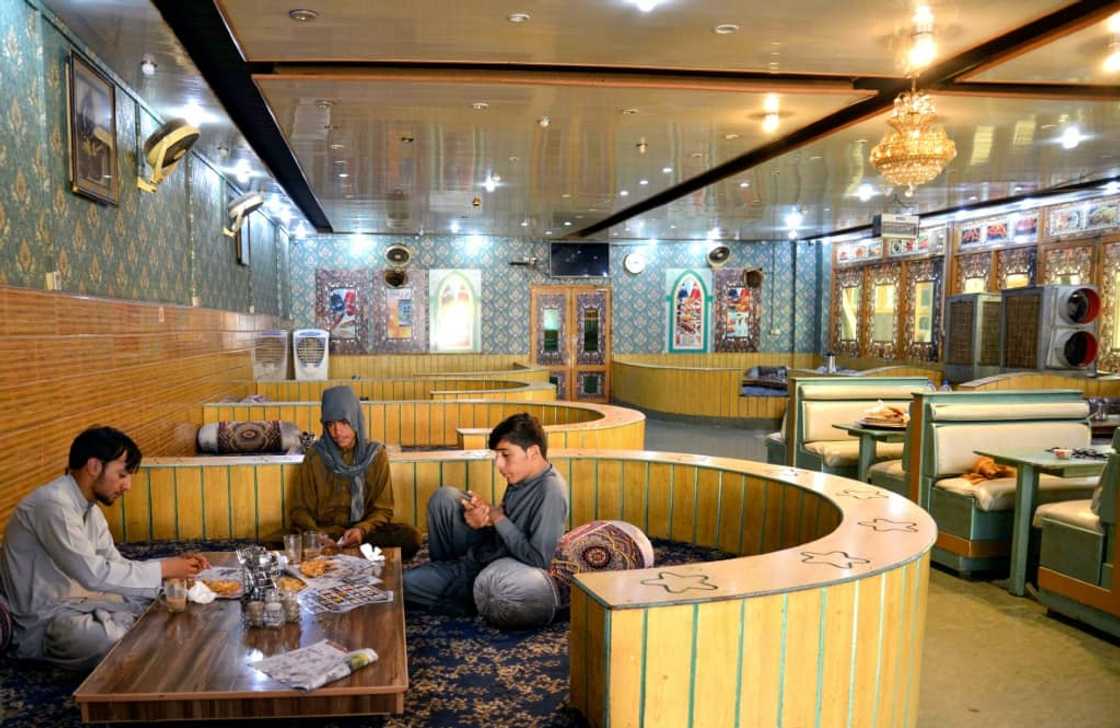 Afghan men have breakfast in a restaurant in Kandahar, home to the power base of Taliban leader Hibatullah Akhundzada