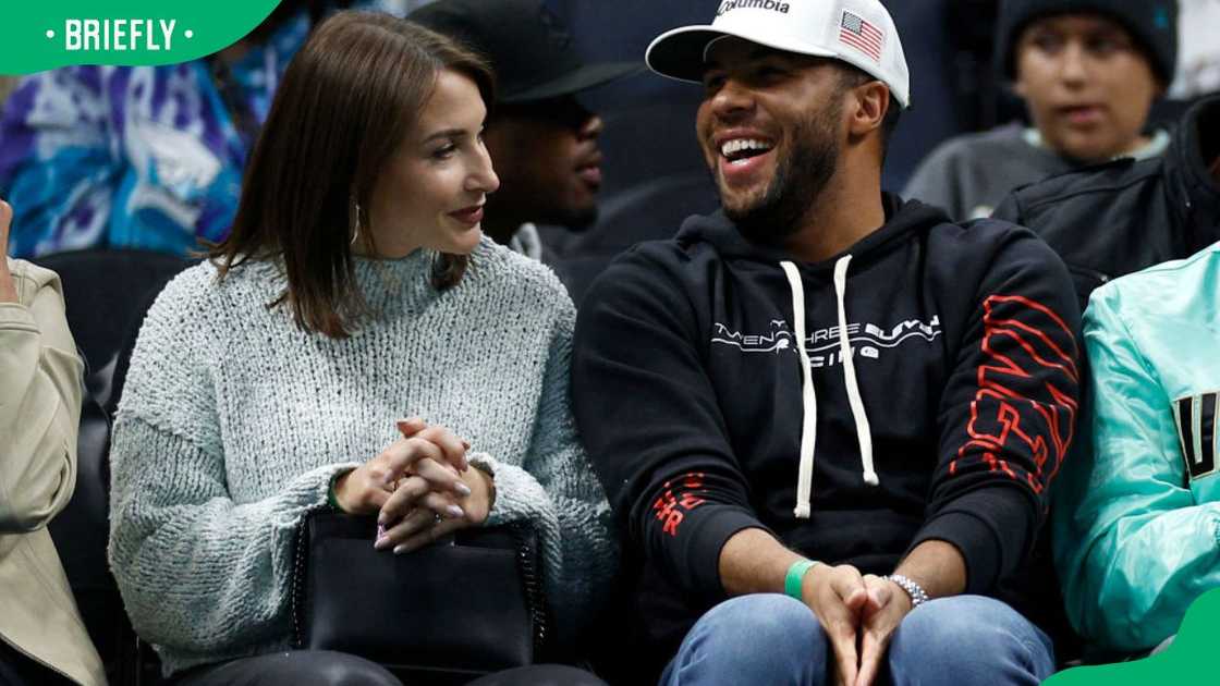 Bubba Wallace and his wife Amanda at the first quarter of the game between the Charlotte Hornets and the Chicago Bulls at Spectrum Center in 2023