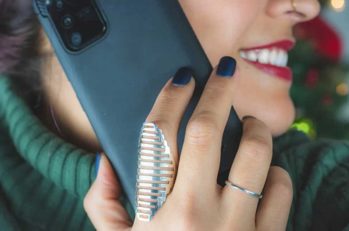 A woman talking on the phone A woman talking on the phone