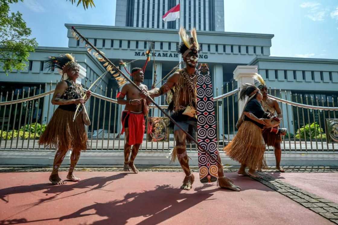 Representatives of the Awyu and Moi Indigenous tribes protest in front of Indonesia's Supreme Court Representatives of the Awyu and Moi Indigenous tribes protest in front of Indonesia's Supreme Court