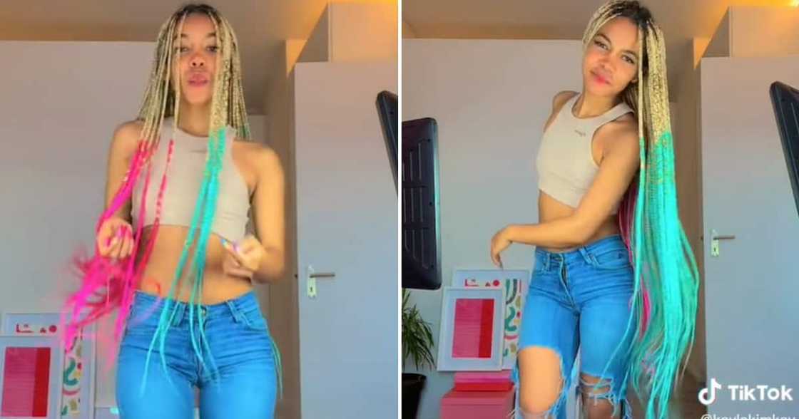 The lady danced and showed off her green and pink braids The lady danced and showed off her green and pink braids