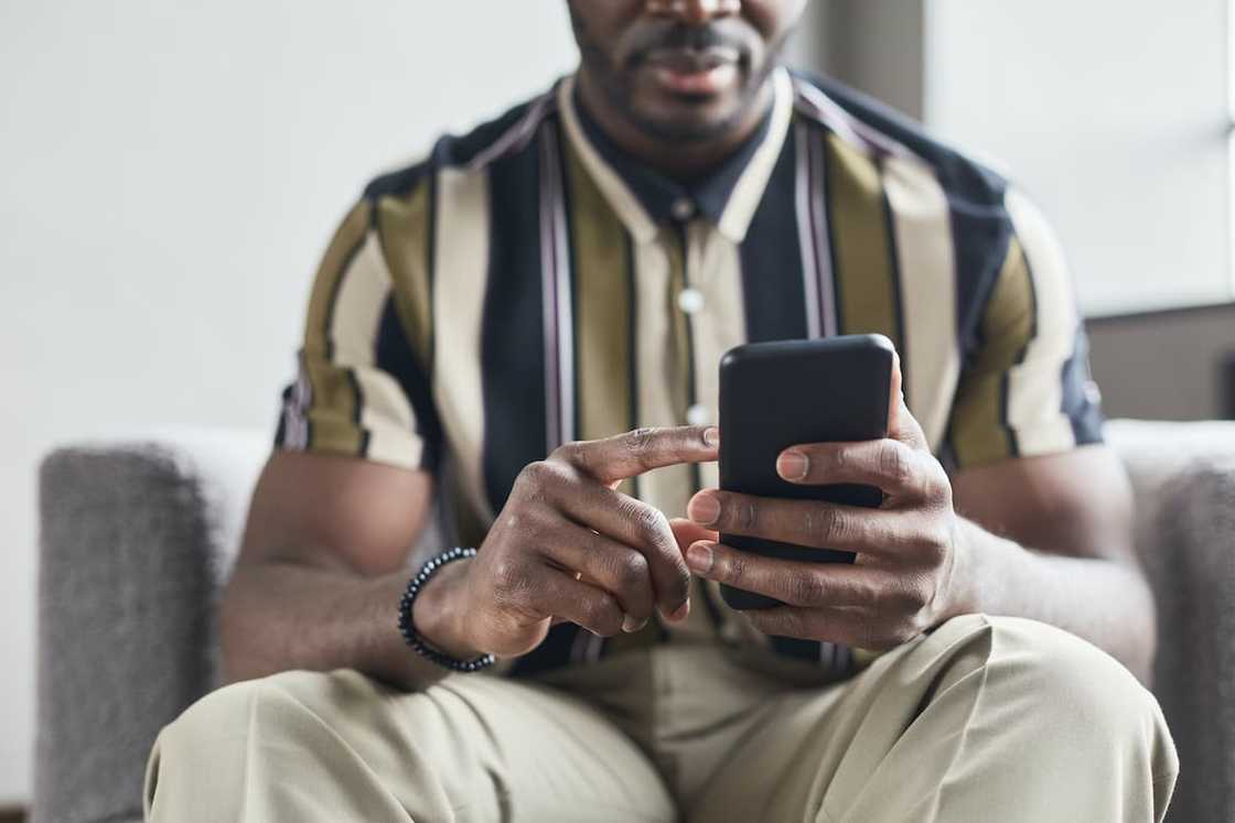 A man using his phone A man using his phone