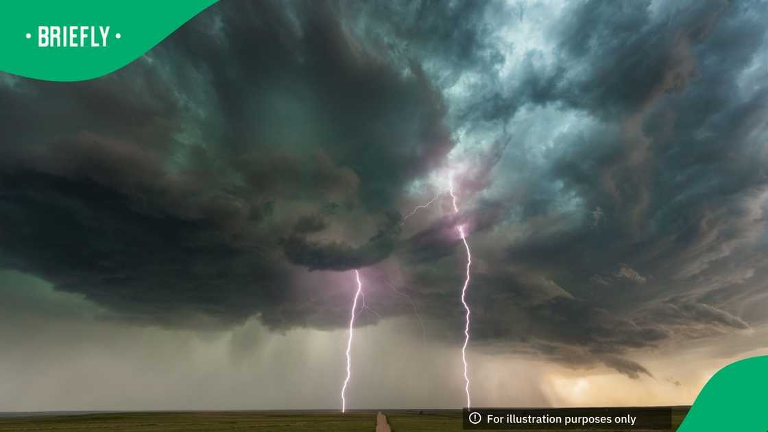 A dramatic display of nature’s raw power unfolds over the vast Colorado plains as twin bolts of lightning strike beneath a swirling supercell. The ominous green-tinged storm clouds dominate the sky, hinting at hail and turbulence within A dramatic display of nature’s raw power unfolds over the vast Colorado plains as twin bolts of lightning strike beneath a swirling supercell. The ominous green-tinged storm clouds dominate the sky, hinting at hail and turbulence within