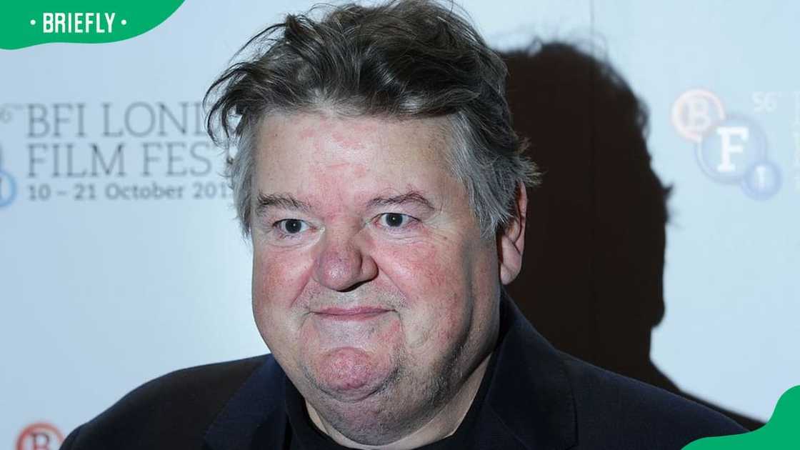 Robbie Coltrane at a red carpet in a black outfit Robbie Coltrane at a red carpet in a black outfit
