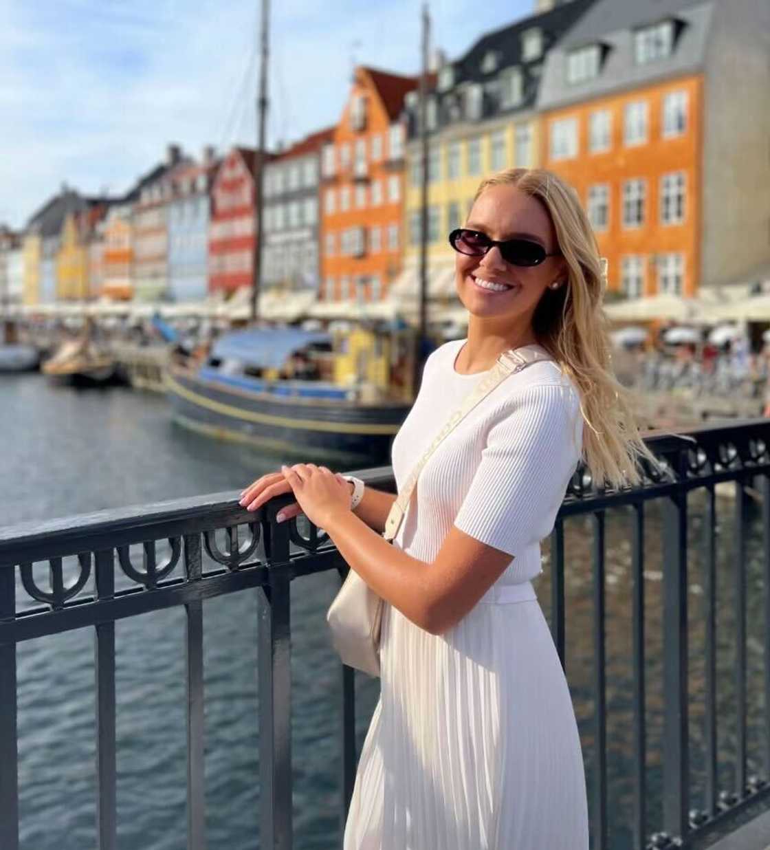 A woman in Cape Town posed in a TikTok video, all dressed in white.