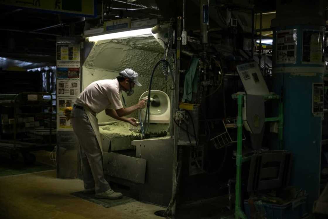 A staff member makes a toilet at a factory of Japanese toilet manufacturer TOTO in the city of Kitakyushu, Fukuoka Prefecture A staff member makes a toilet at a factory of Japanese toilet manufacturer TOTO in the city of Kitakyushu, Fukuoka Prefecture