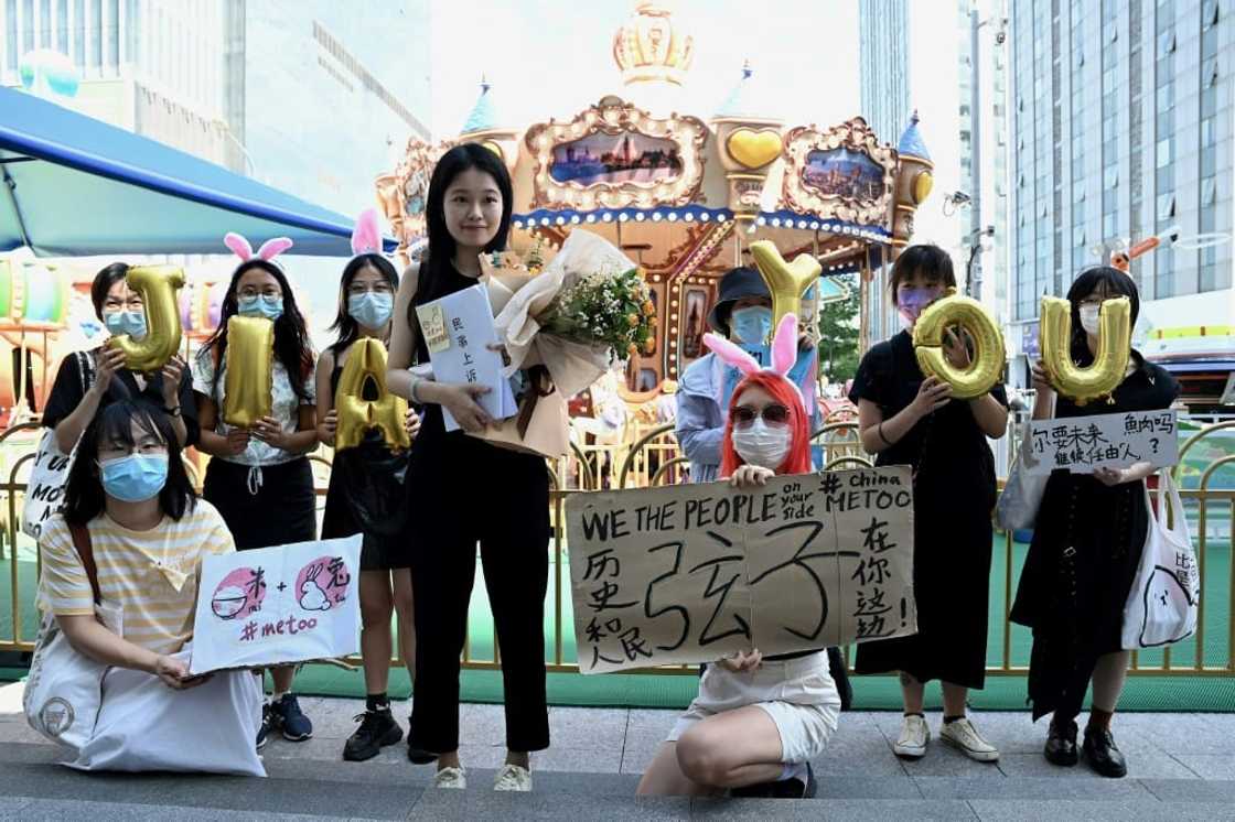 A small group of supporters wished Zhou Xiaoxuan (C) well ahead of her appeal hearing in Beijing A small group of supporters wished Zhou Xiaoxuan (C) well ahead of her appeal hearing in Beijing