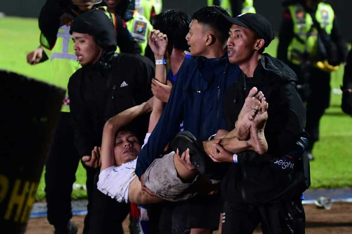 People were crushed and suffocated when theyran to one exit, according to police People were crushed and suffocated when theyran to one exit, according to police