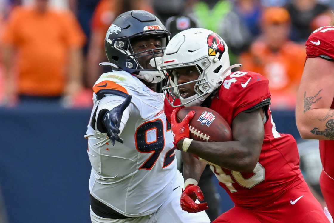Arizona Cardinals running back Hassan Hall and Denver Broncos linebacker Dondrea Tillman Arizona Cardinals running back Hassan Hall and Denver Broncos linebacker Dondrea Tillman