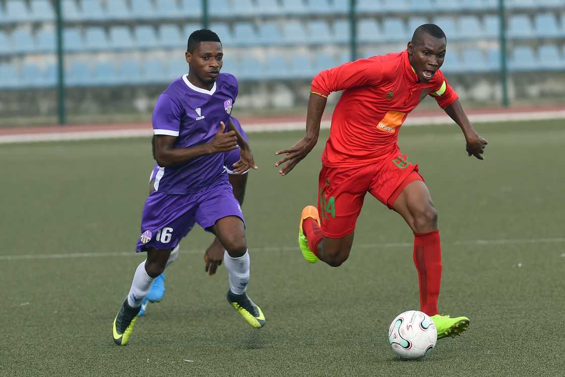 Charles Baye and Seydou Diallo during the CAF Confederation Cup playoff match at the Agege Stadium