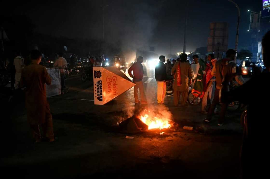 Khan's supporters lit fires and staged protests in Karachi, and other cities, after hearing he had been shot