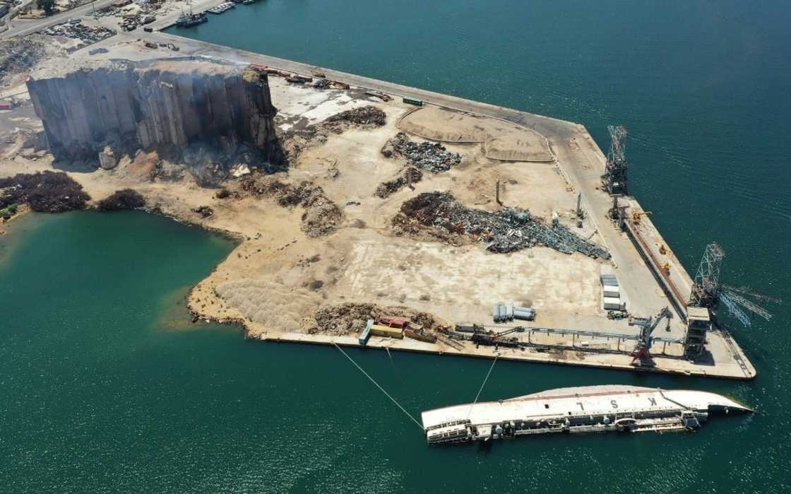 Beirut's blast-hit port, and a capsized ship, seen on July 29, 2022: the explosion destroyed thousands of homes Beirut's blast-hit port, and a capsized ship, seen on July 29, 2022: the explosion destroyed thousands of homes