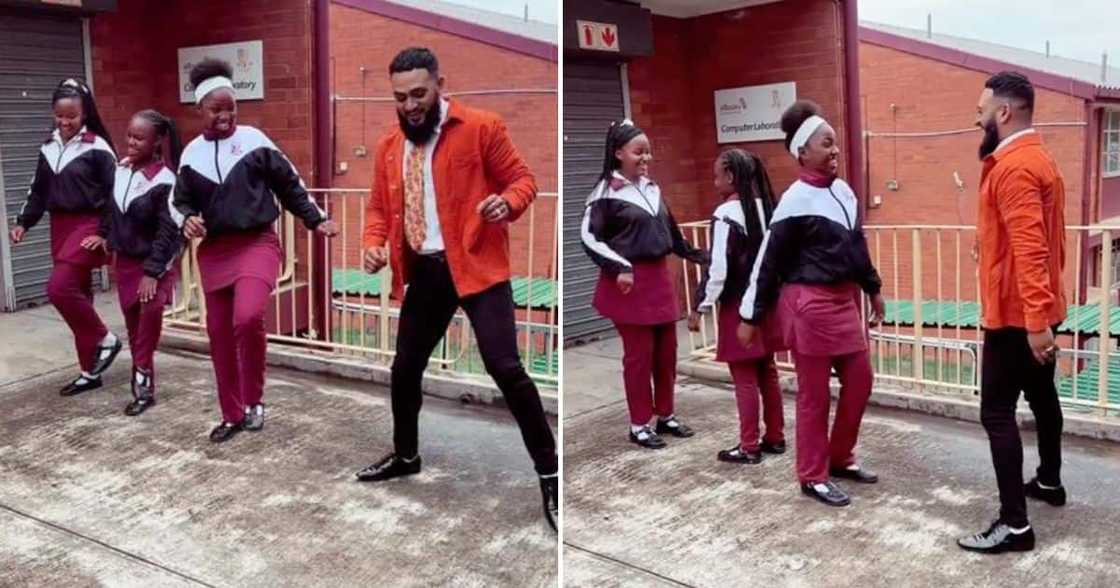 Teacher flexes dance moves with students.