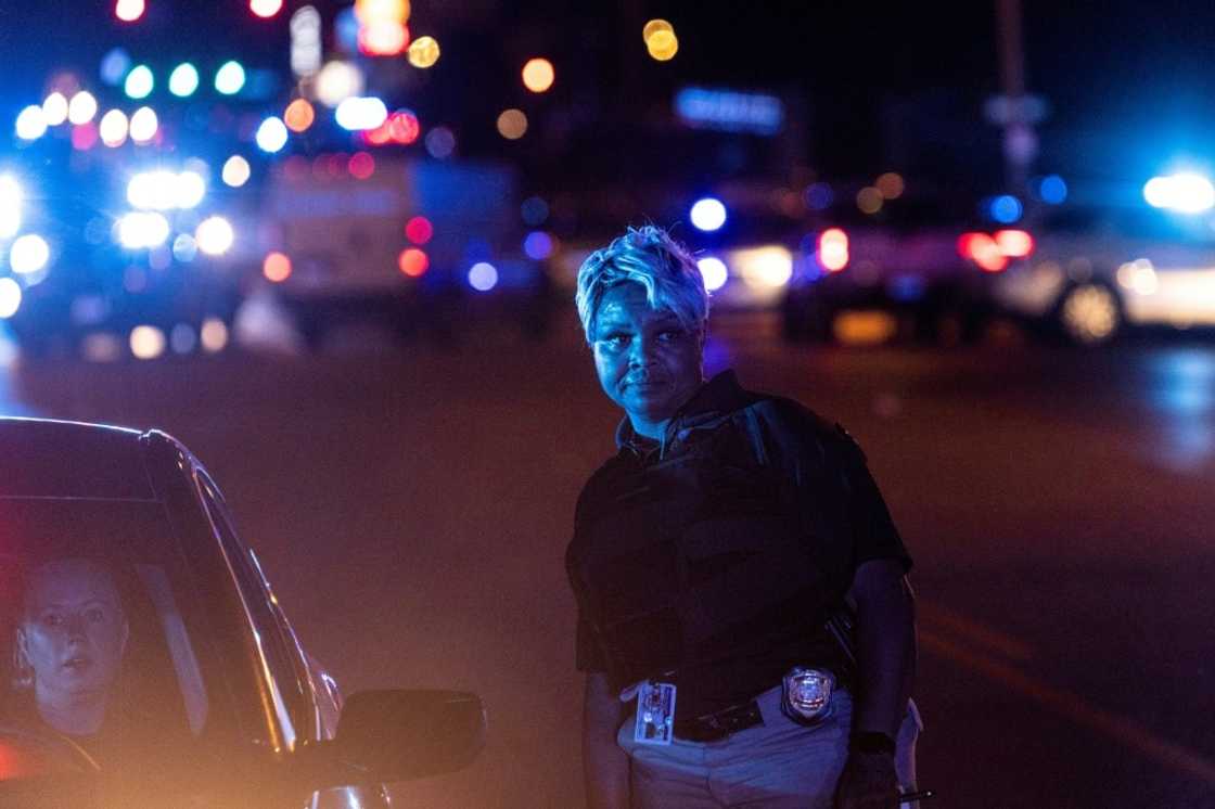 Police investigate the scene of a carjacking related to the Memphis shooting spree Police investigate the scene of a carjacking related to the Memphis shooting spree