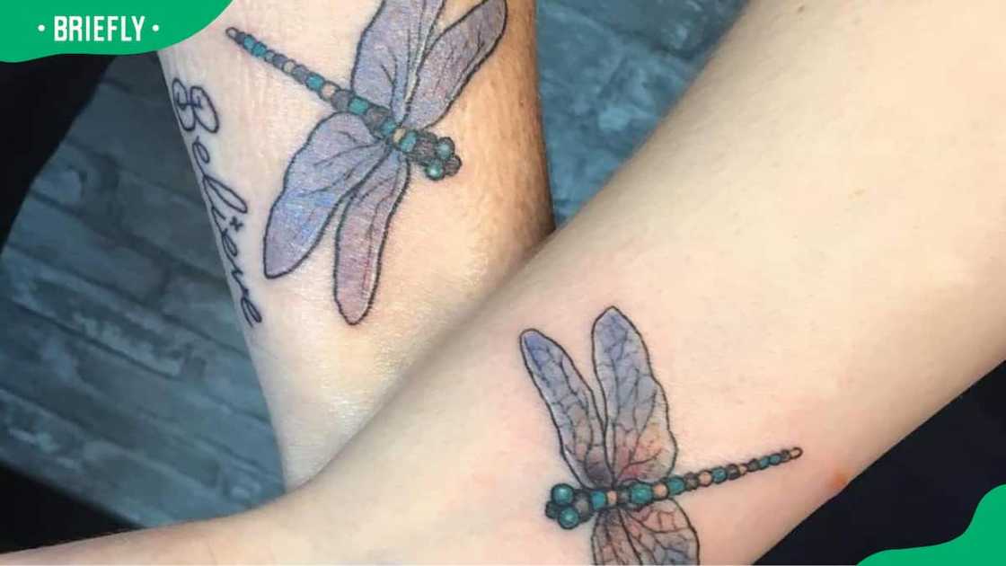 Matching dragonfly wrist tattoos Matching dragonfly wrist tattoos