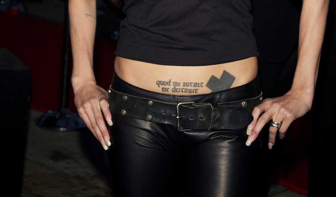 Angelina Jolie's Cross and Latin Script tattoo Angelina Jolie's Cross and Latin Script tattoo