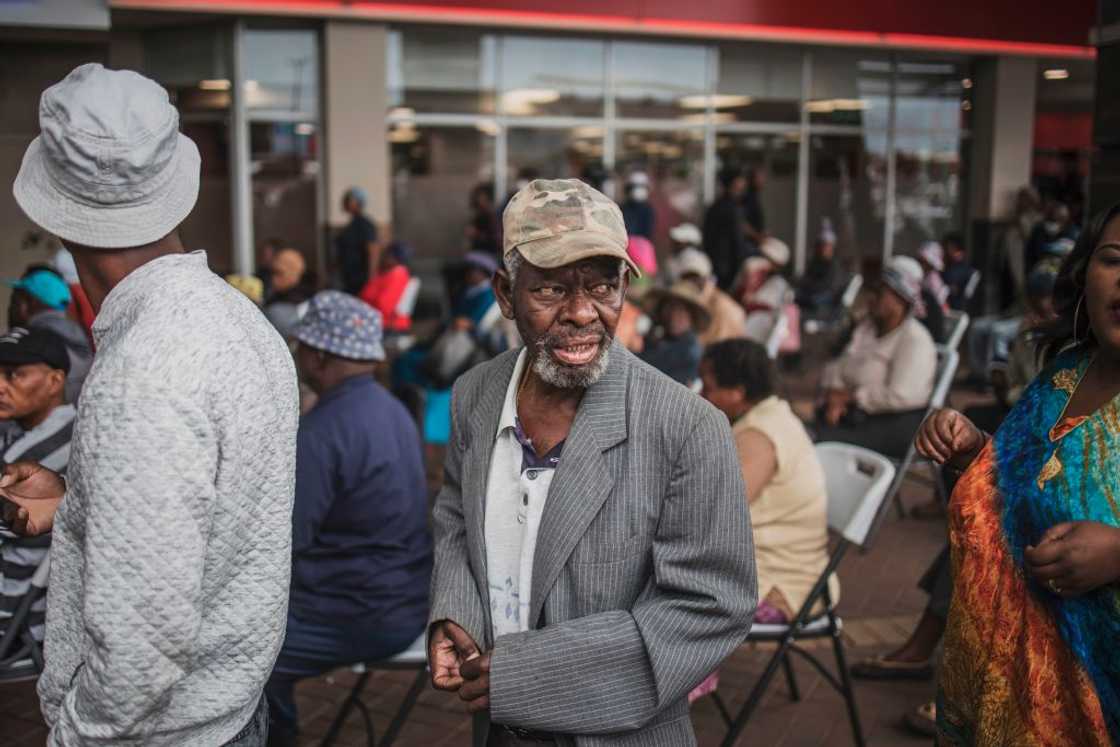 An elderly man from Soweto, looks on while queuing at a SASSA (South African Social Security Agency) pay-point in Soweto on March 30, 2020 An elderly man from Soweto, looks on while queuing at a SASSA (South African Social Security Agency) pay-point in Soweto on March 30, 2020