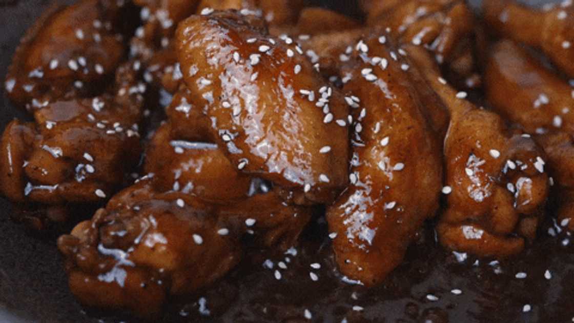 Preparing sticky chicken wings with Coke