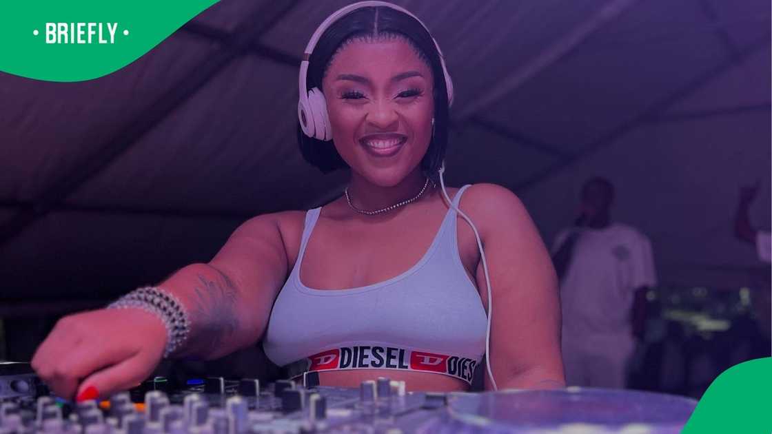 Gogo Skhotheni is performing as a DJ. Gogo Skhotheni is performing as a DJ.