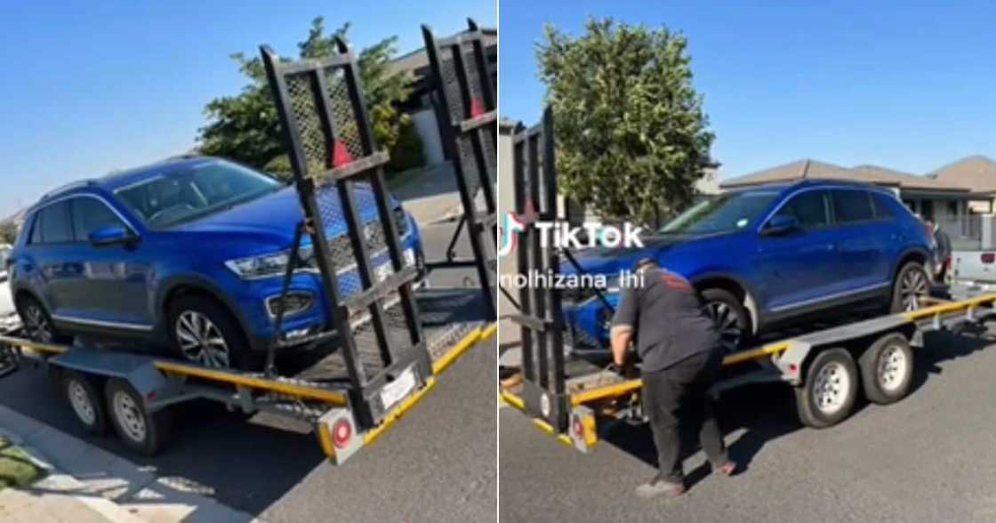 South African woman lets go of car South African woman lets go of car