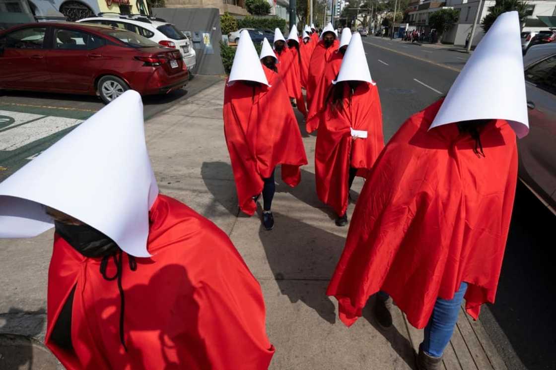 Protesters denounce violence against women in Peru during a visit by UN human rights chief Michelle Bachelet on July 18, 2022