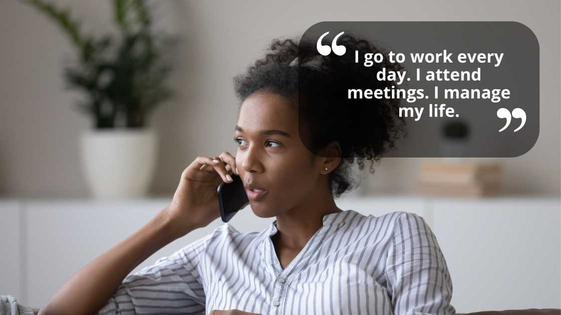 A young female making a call while sitting on a couch