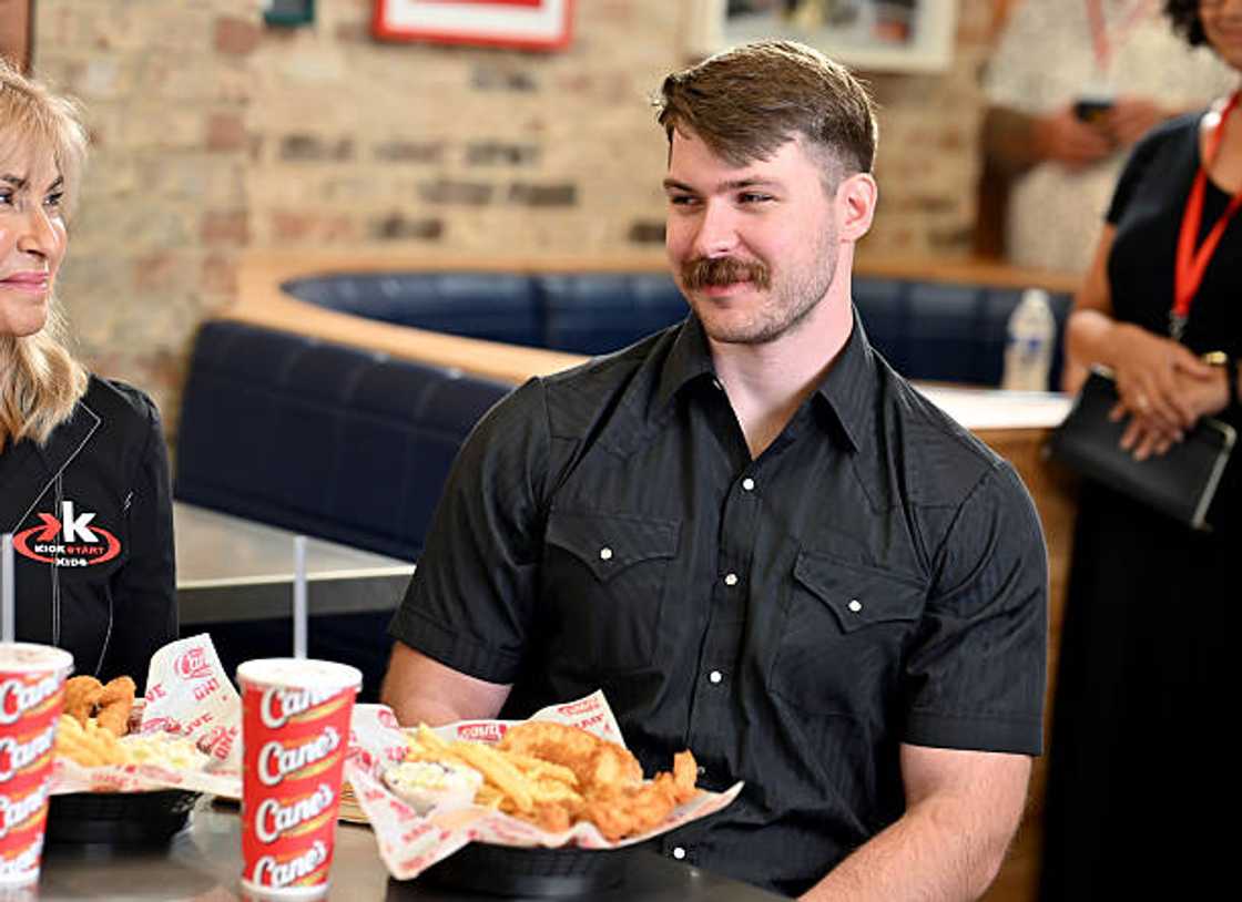 Dakota Norris with Raising Cane's owner and founder Todd Graves. Dakota Norris with Raising Cane's owner and founder Todd Graves.