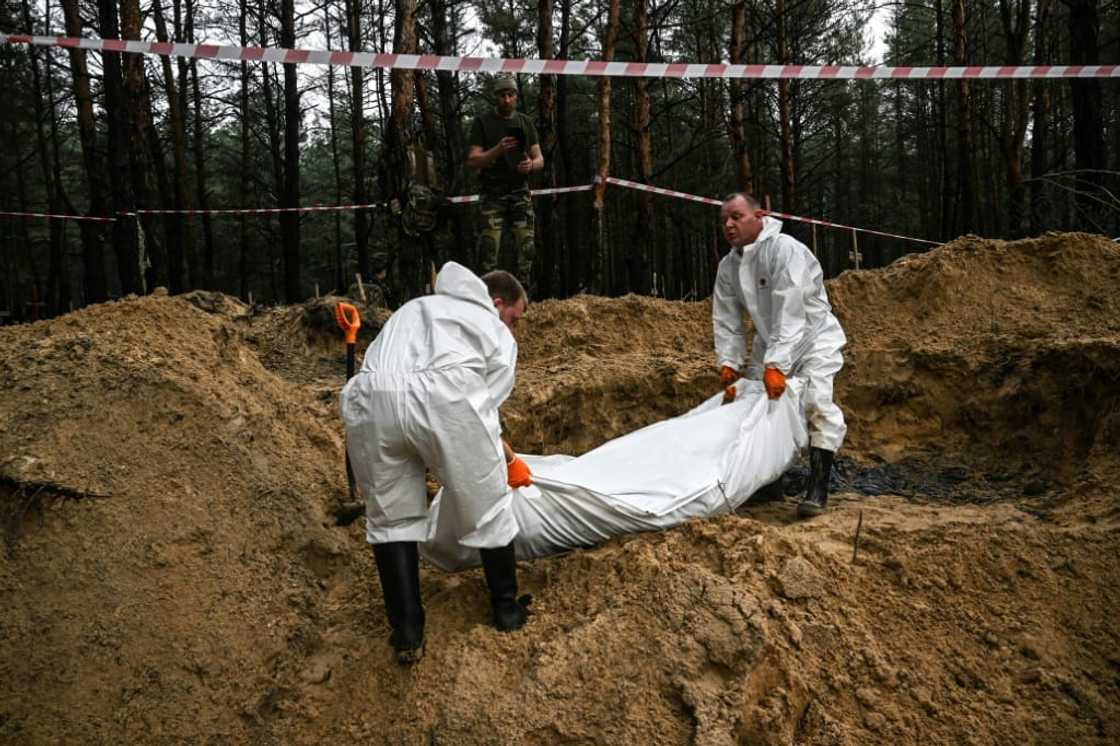 Ukraine authorities say they have discovered hundreds of graves outside the recaptured city of Izyum