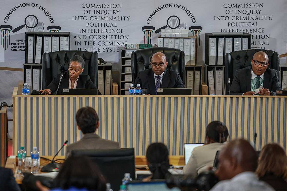 Commissioner Sesi Baloyi, Retired South African Constitutional Court Justice and former acting Deputy Chief Justice Mbuyiseni Madlanga and Commissioner Sandile Khumalo listen to evidence during the Madlanga Commission on August 24, 2026 Commissioner Sesi Baloyi, Retired South African Constitutional Court Justice and former acting Deputy Chief Justice Mbuyiseni Madlanga and Commissioner Sandile Khumalo listen to evidence during the Madlanga Commission on August 24, 2026