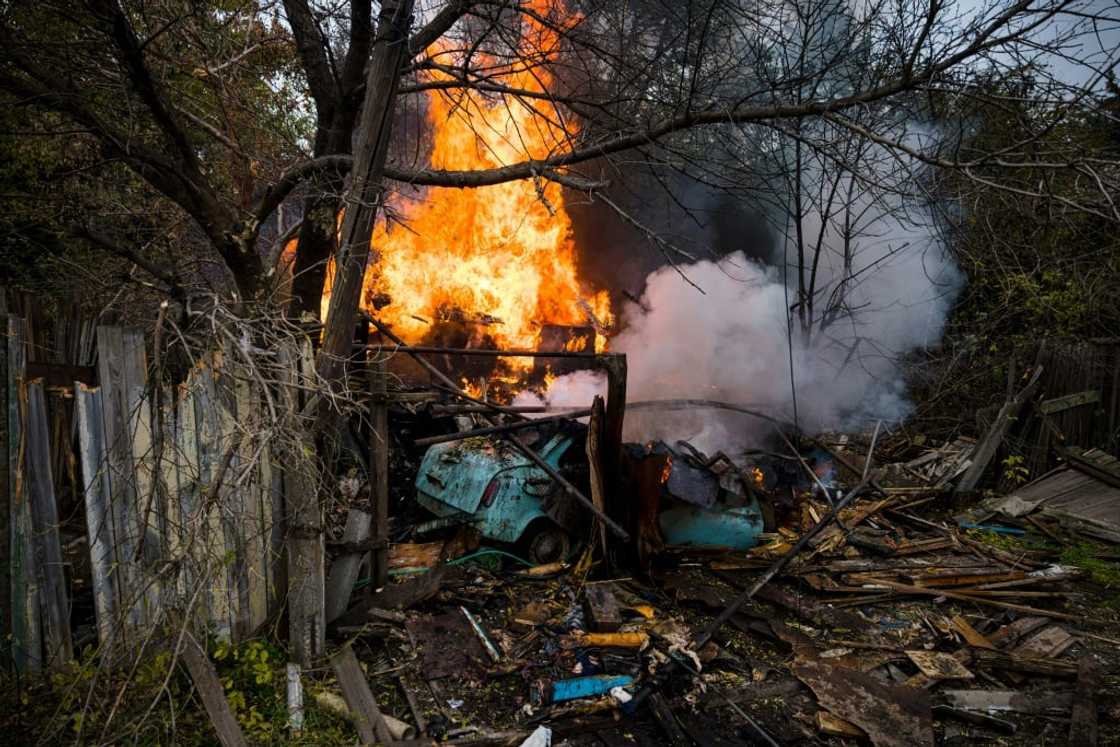 A fire burning through a structure after shelling in the town of Bakhmut on October 23, 2022 A fire burning through a structure after shelling in the town of Bakhmut on October 23, 2022