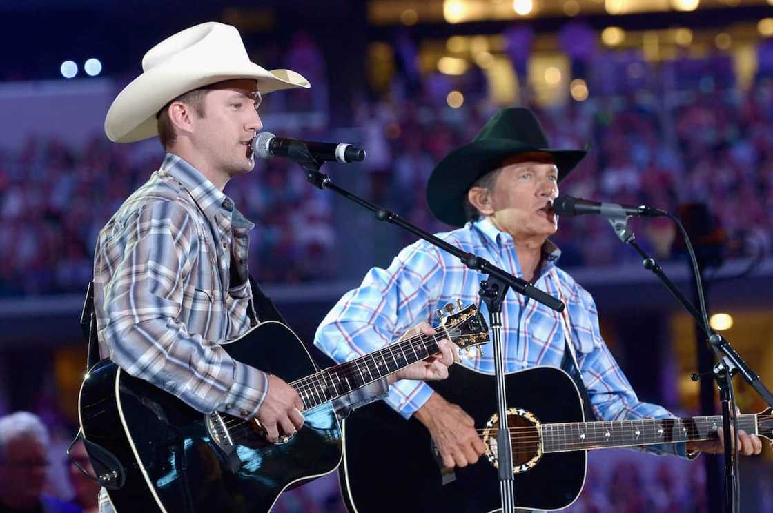 Country singer George with son Bubba perform onstage at George Strait's The Cowboy Rides Away Tour final stop at AT&T Stadium on 7th June 2014. Country singer George with son Bubba perform onstage at George Strait's The Cowboy Rides Away Tour final stop at AT&T Stadium on 7th June 2014.