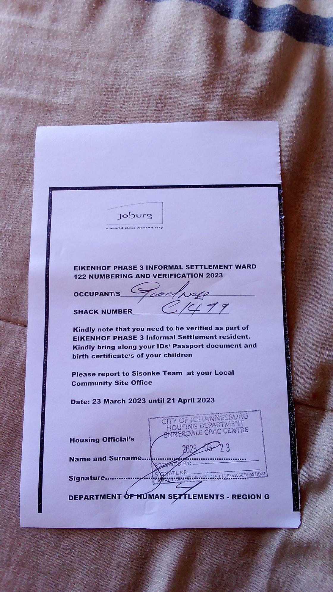 Young woman shows the title deeds of the property Young woman shows the title deeds of the property