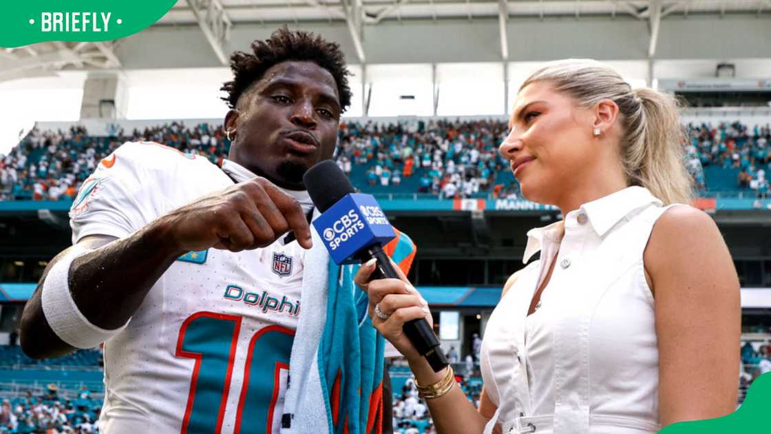 Tyreek Hill and Melanie Collins during a 2024 interview at the Hard Rock in Miami Gardens, Florida Tyreek Hill and Melanie Collins during a 2024 interview at the Hard Rock in Miami Gardens, Florida