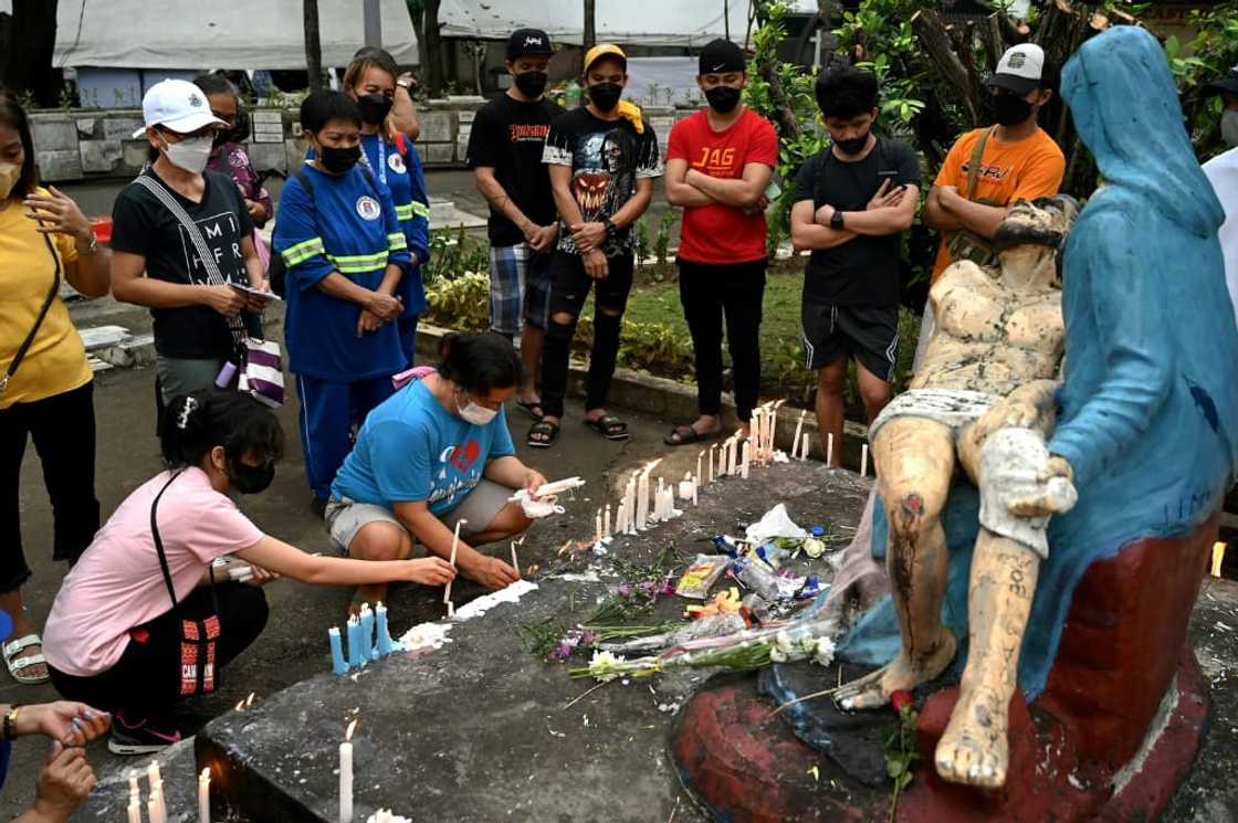 Millions of Filipinos normally go to cemeteries on the day to remember their dead relatives by praying, lighting candles and leaving flowers at the gravesites Millions of Filipinos normally go to cemeteries on the day to remember their dead relatives by praying, lighting candles and leaving flowers at the gravesites