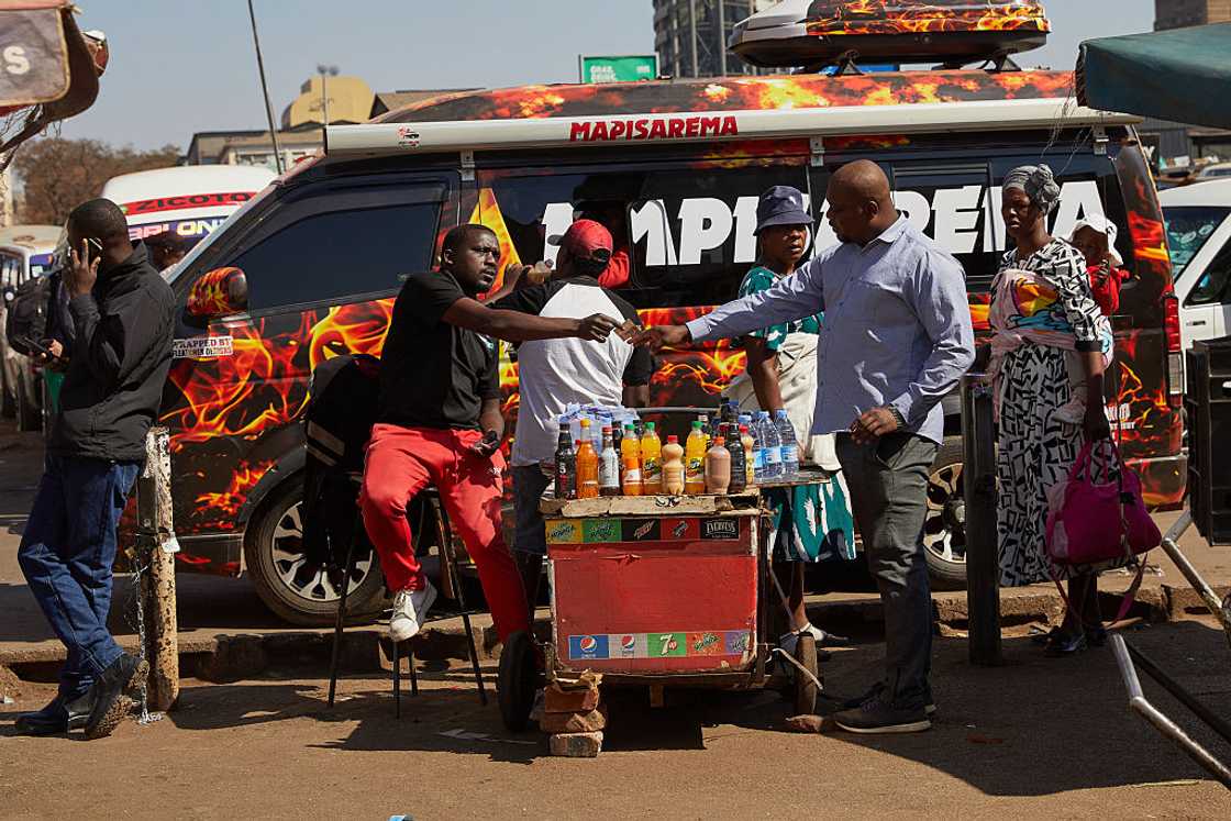 Street vendors sell their merchandises as residents go about their business as usual in Harare's central business district despite calls for protests in opposition to the Constitutional Amendment Bill No 3, on July 31 2026