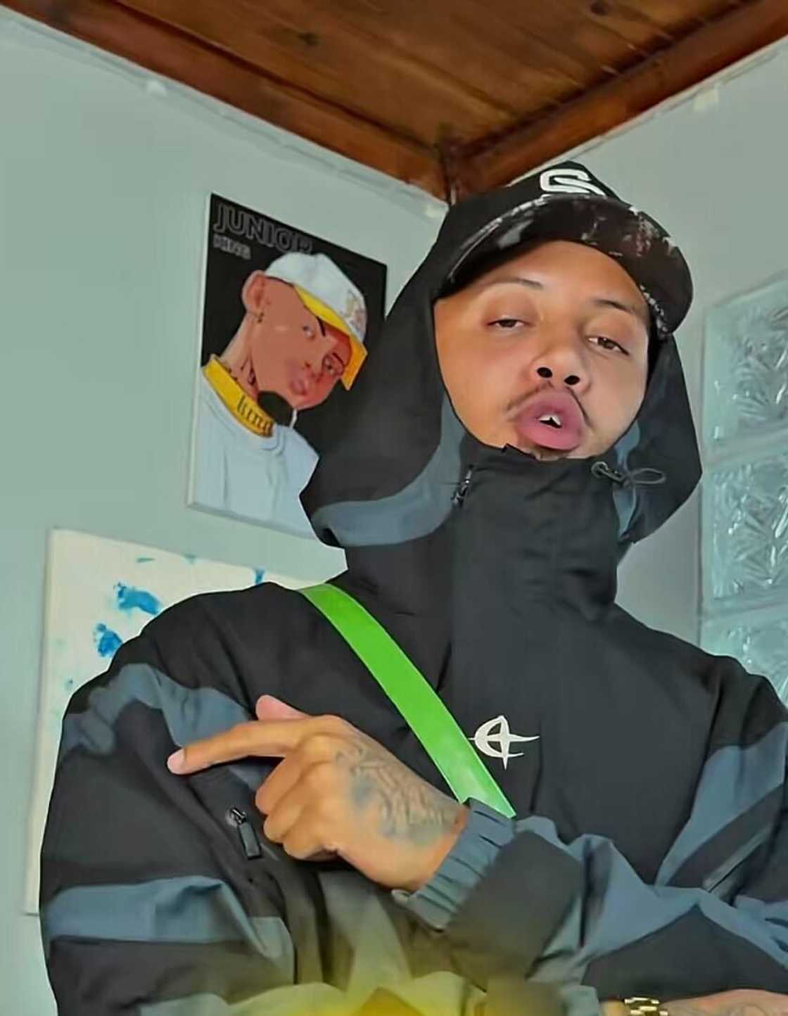 The late talented artist Junior King posed in a TikTok video.