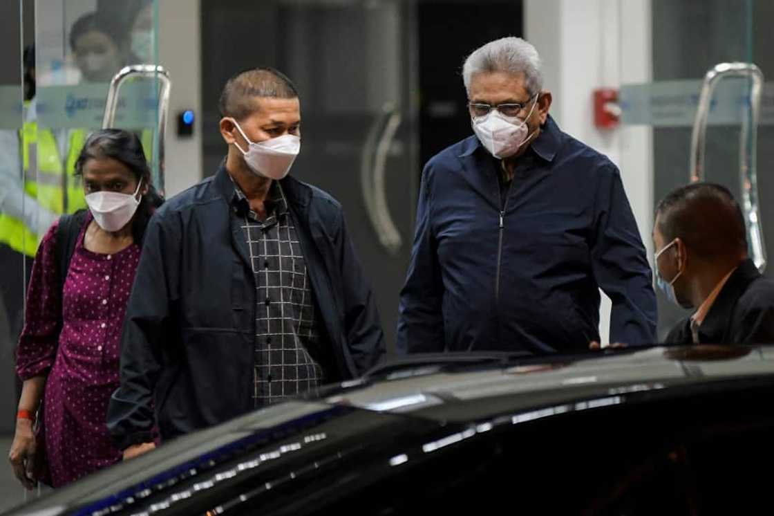 Former Sri Lankan president Gotabaya Rajapaksa (2nd R) has been living in a Thai hotel