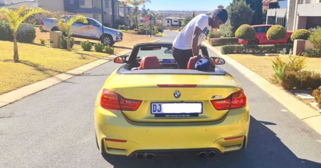 Local DJ Celebrates the “Small Things” While Posing in His Luxury BMW