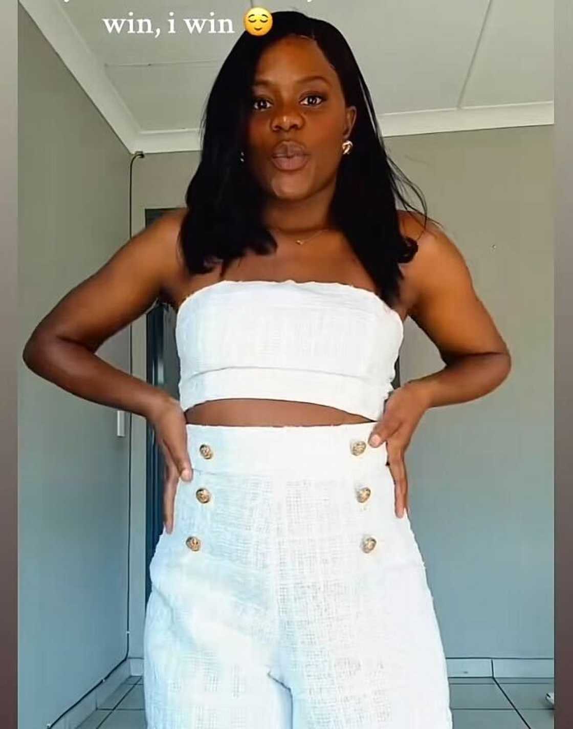 A woman in South Africa posed in a TikTok video dressed in all white. A woman in South Africa posed in a TikTok video dressed in all white.