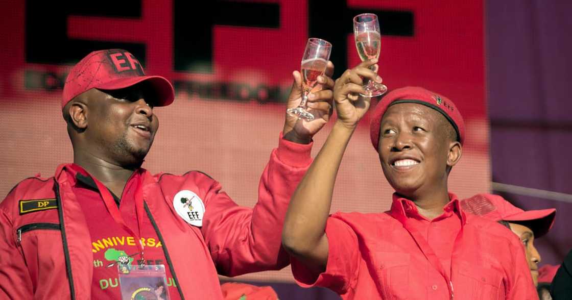 Leader of the South African radical-left opposition party Economic Freedom Fighters (EFF), Julius Malema (C) and EFF Deputy President Floyd Shivambu raise a toast during a mass rally Leader of the South African radical-left opposition party Economic Freedom Fighters (EFF), Julius Malema (C) and EFF Deputy President Floyd Shivambu raise a toast during a mass rally