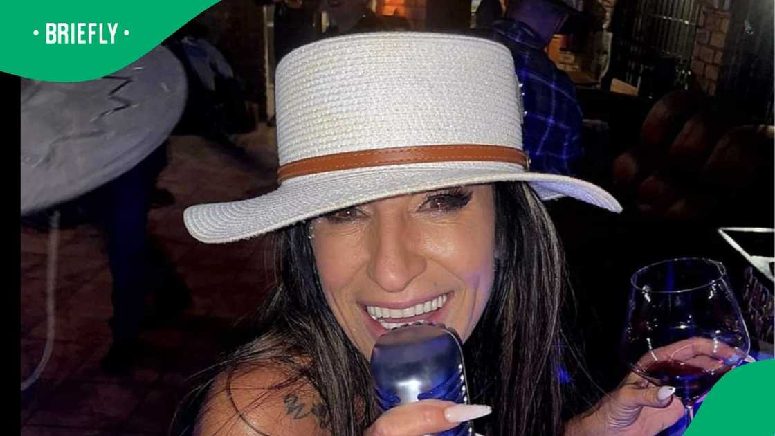 Woman shows she loves traditional South African meal Woman shows she loves traditional South African meal